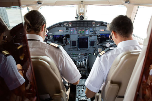 Two pilots in airplane cockpit