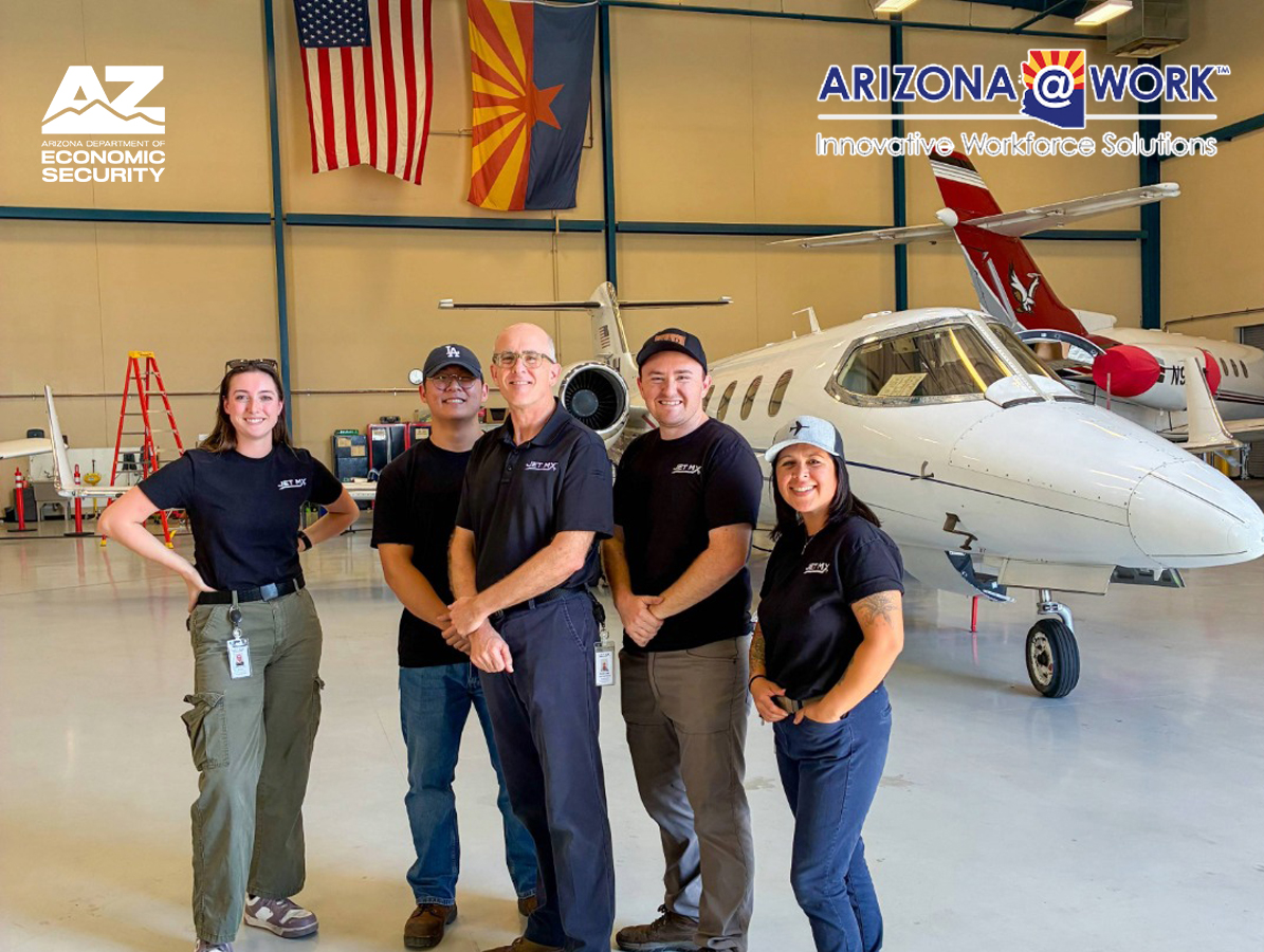 Mechanic working on a jet plane with tools